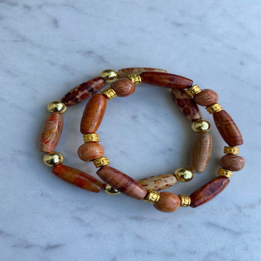 Brown wood and gold color bead stretchy bracelet.